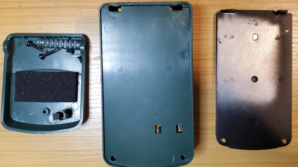 After taking off the metal backplate and plastic battery cover.