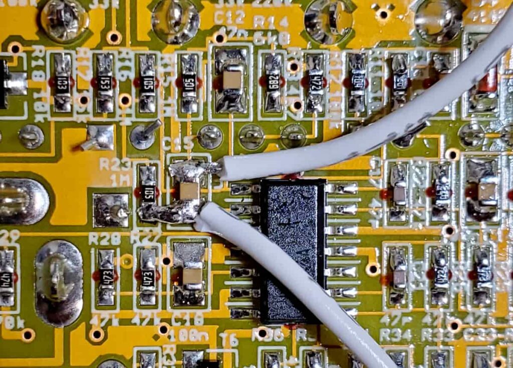 Example of soldering wires onto surface mount component pads.