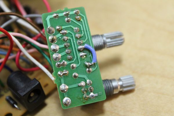 The TS9DX daughter board with the Mode switch. All solder joints were reflowed and a jumper wire was installed for a particularly suspected faulty trace.